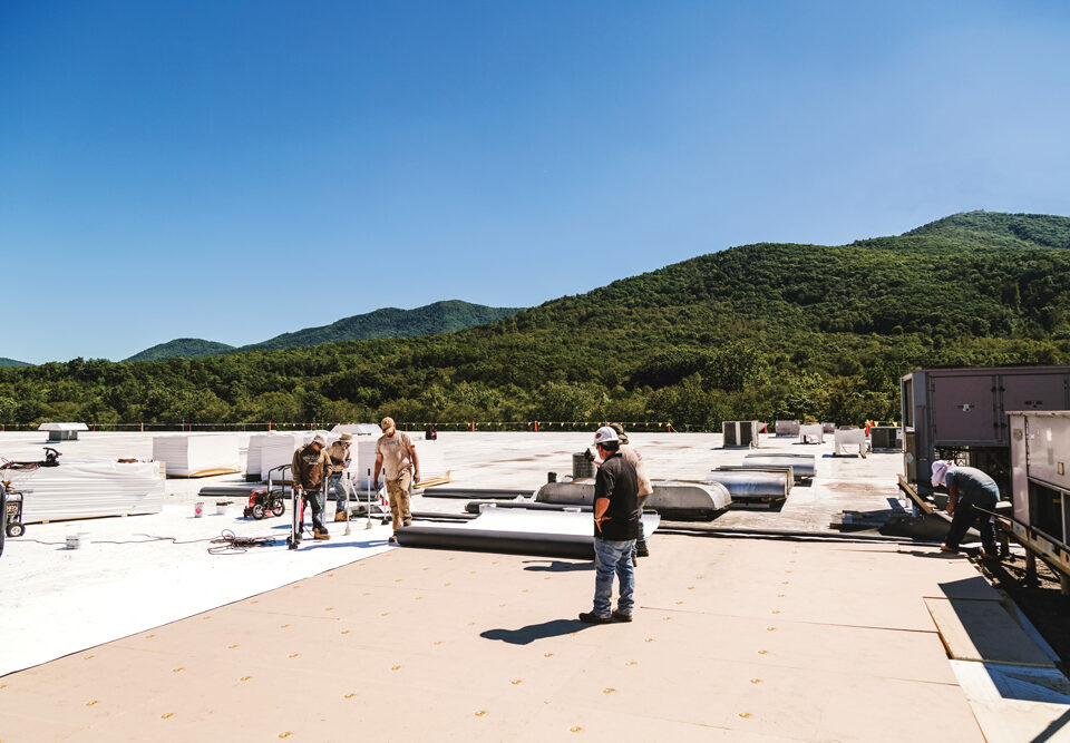 workers on a commercial roof