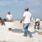 workers installing tpo roofing