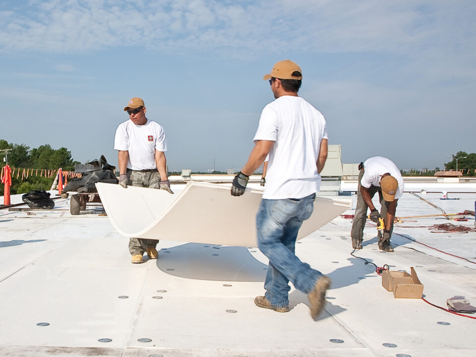 workers installing tpo roofing