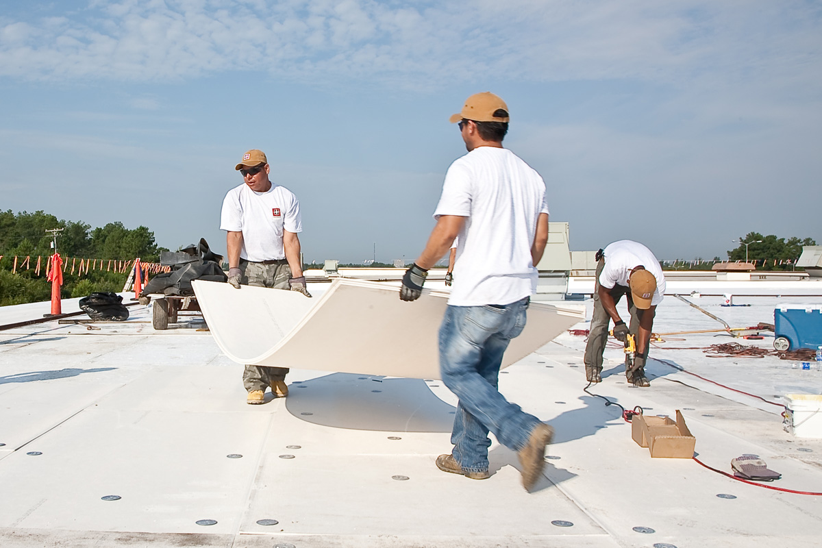 workers installing tpo roofing