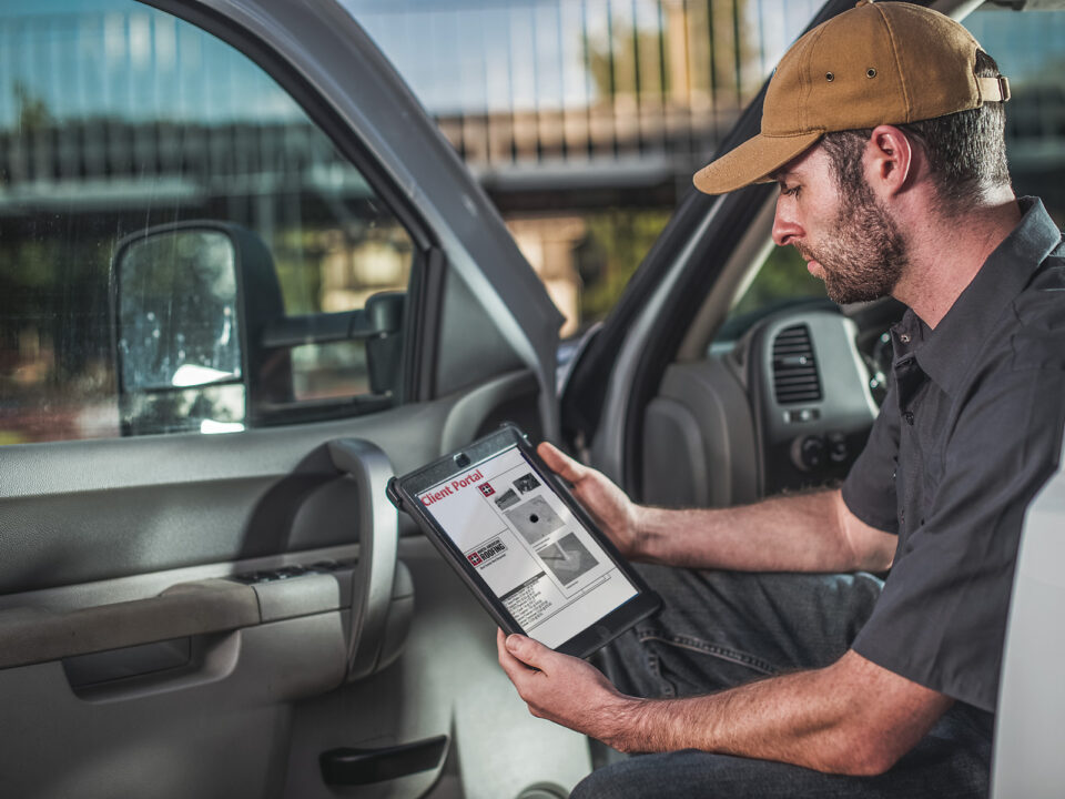 worker looking at a tablet