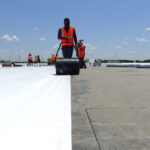 workers installing commercial roofing