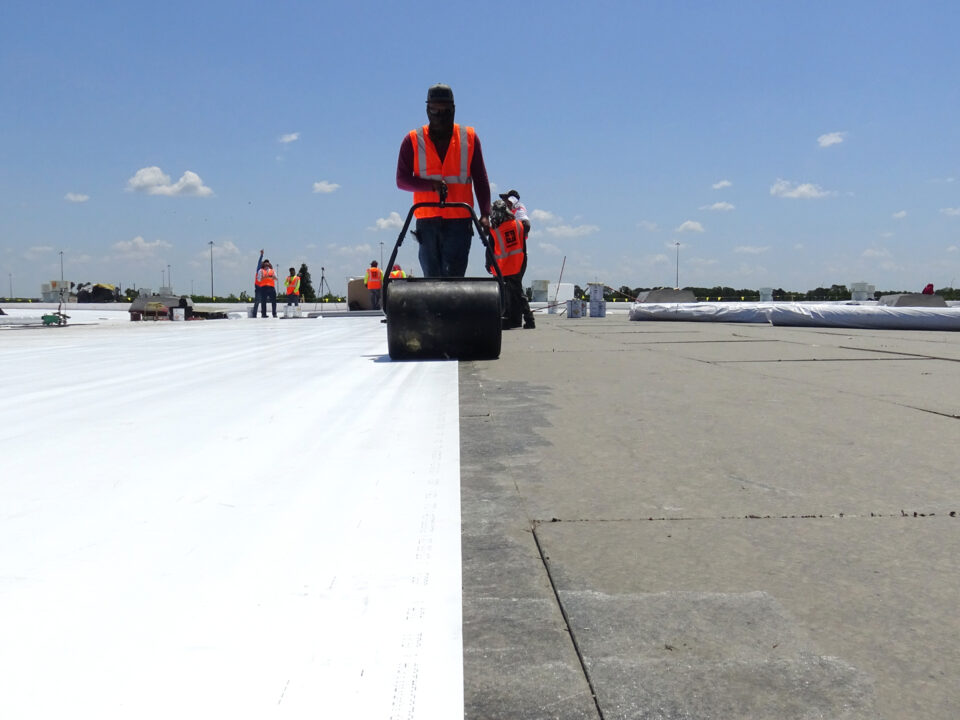workers installing commercial roofing