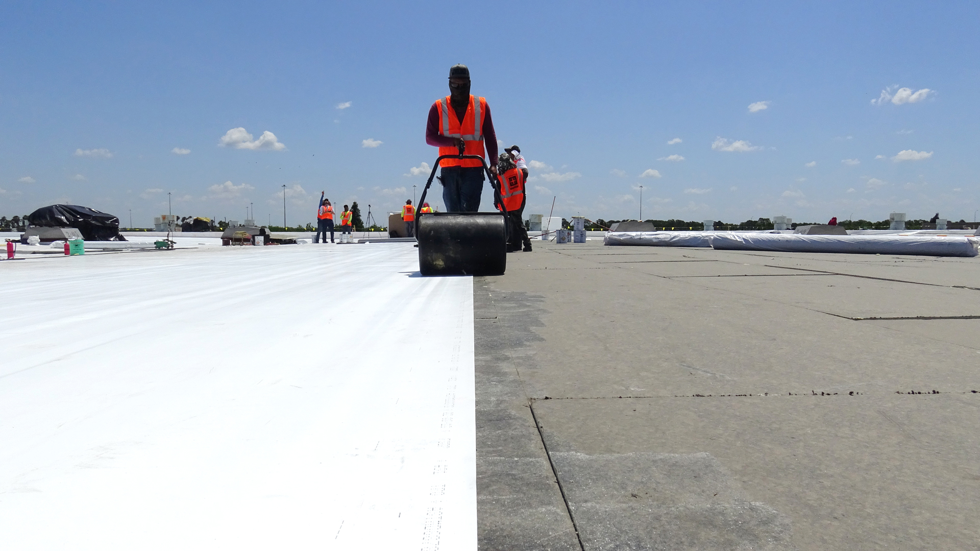 workers installing commercial roofing
